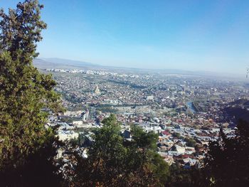 Aerial view of cityscape against clear sky