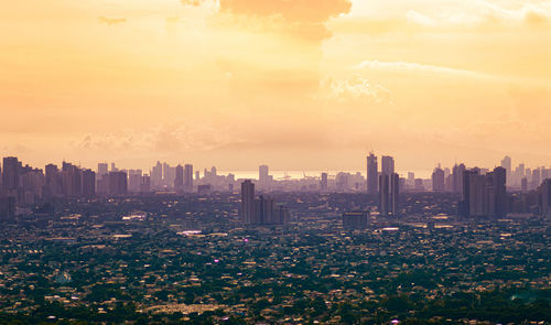 High angle view of buildings against sky during sunset