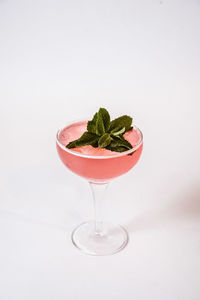 Close-up of drink against white background