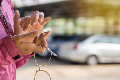 Close-up of hand holding smart phone