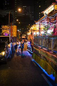 People walking on street at night