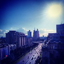 View of city street at sunset