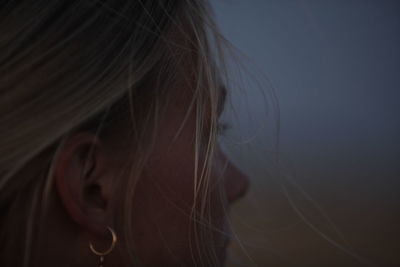 Close-up of woman against sky