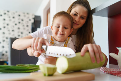 Portrait of mother and daughter at home