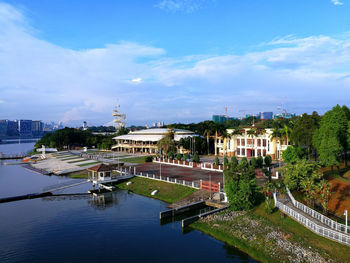 High angle view of river amidst buildings against sky