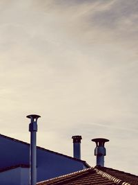 Low angle view of street light against sky
