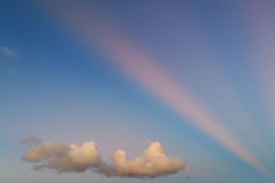 Low angle view of rainbow against sky