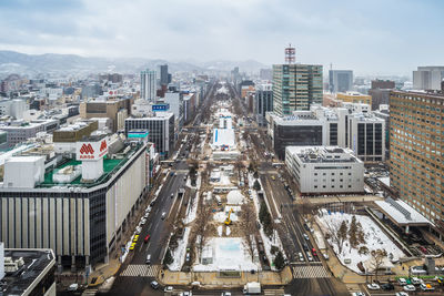 High angle view of street amidst buildings in city