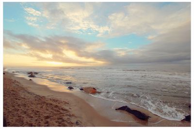 Scenic view of sea against cloudy sky