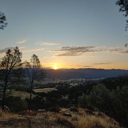 Scenic view of landscape against sky during sunset