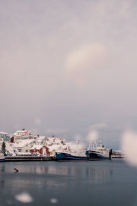 Ships at harbour, with some snow in the foreground.