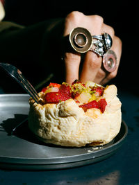 Close-up of cutting cake