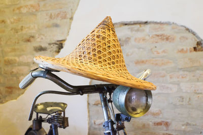 Close-up of bicycle against wall