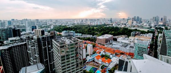 High angle view of modern buildings in city against sky