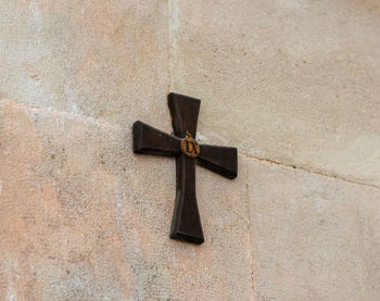 Close-up of cross on wall