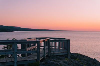 Scenic view of sea against clear sky during sunset