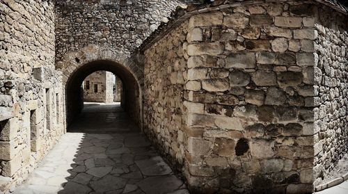 Staircase leading to brick wall