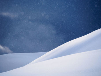 Tree on snow covered landscape against sky