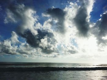 Scenic view of sea against cloudy sky