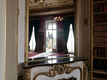 Reflection of house on window at home