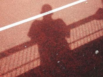 Shadow of people on road