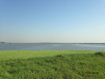 Scenic view of calm sea against clear sky