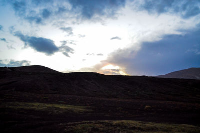 Scenic view of field against sky during sunset