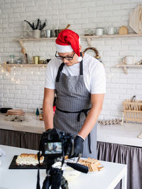 Man working in kitchen at restaurant