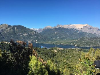 Scenic view of mountains against clear blue sky