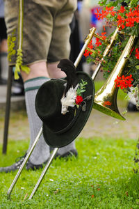 Close-up of person standing by flower plants