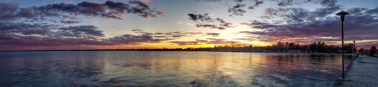 SCENIC VIEW OF SUNSET OVER LAKE