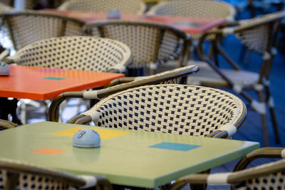 Full frame shot of empty chairs and tables at sidewalk cafe