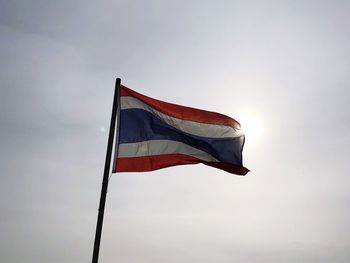 Low angle view of flag against sky