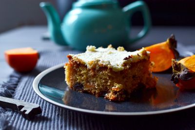 Persimmon and chocolate raisins cake with cream cheese frosting