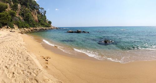 Scenic view of beach against sky