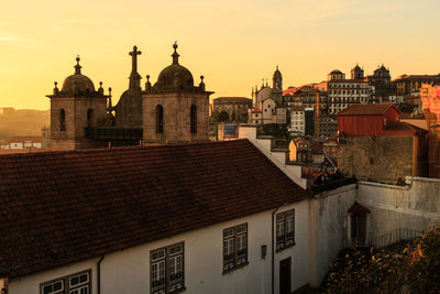  buildings and churches in the city against clear sky