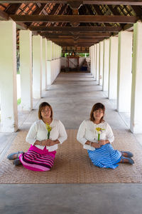 Women sitting in corridor