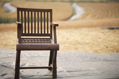 Empty bench on field