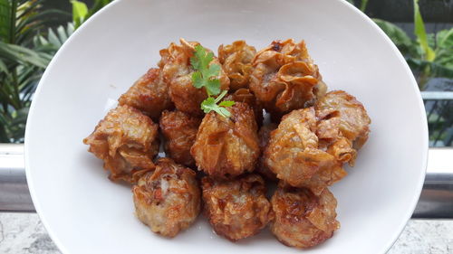 High angle view of meat in plate on table
