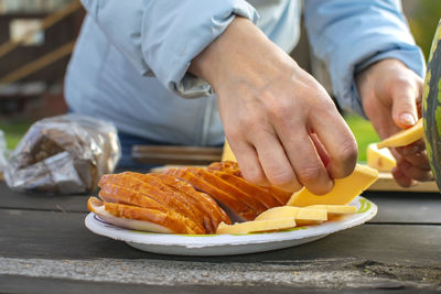 Midsection of man preparing food