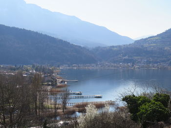 High angle view of lake and mountains against sky