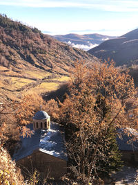 Aerial view of trees and buildings against sky