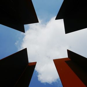 Low angle view of building against cloudy sky