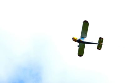 Low angle view of airplane against clear sky