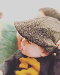 Midsection of boy wearing hat