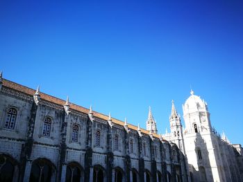 Low angle view of building against blue sky