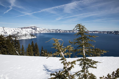 Scenic view of snow covered mountains against sky