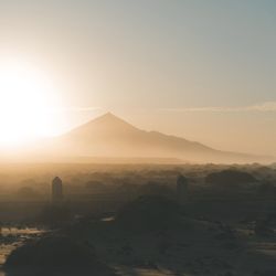 Scenic view of mountains against sky during sunset