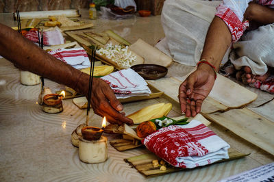 Cropped image of people during puja