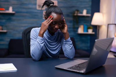 Overworked businesswoman working at office